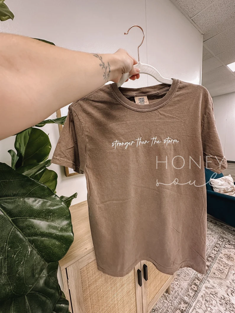 Embroidered Stronger Than The Storm Tee T_M43